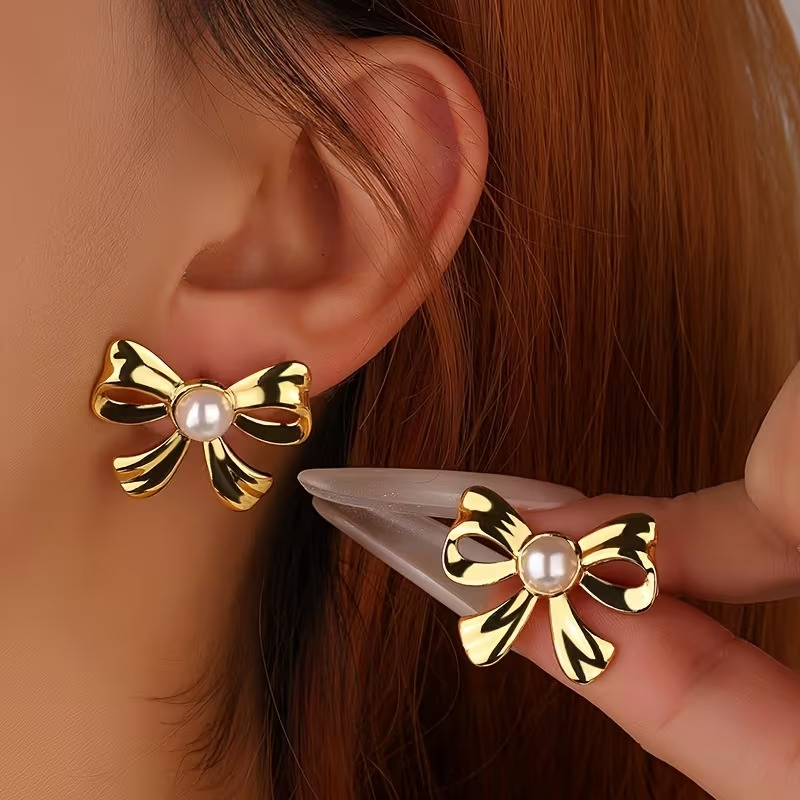 Elegant Pearl Hollow Bow Stud Earrings